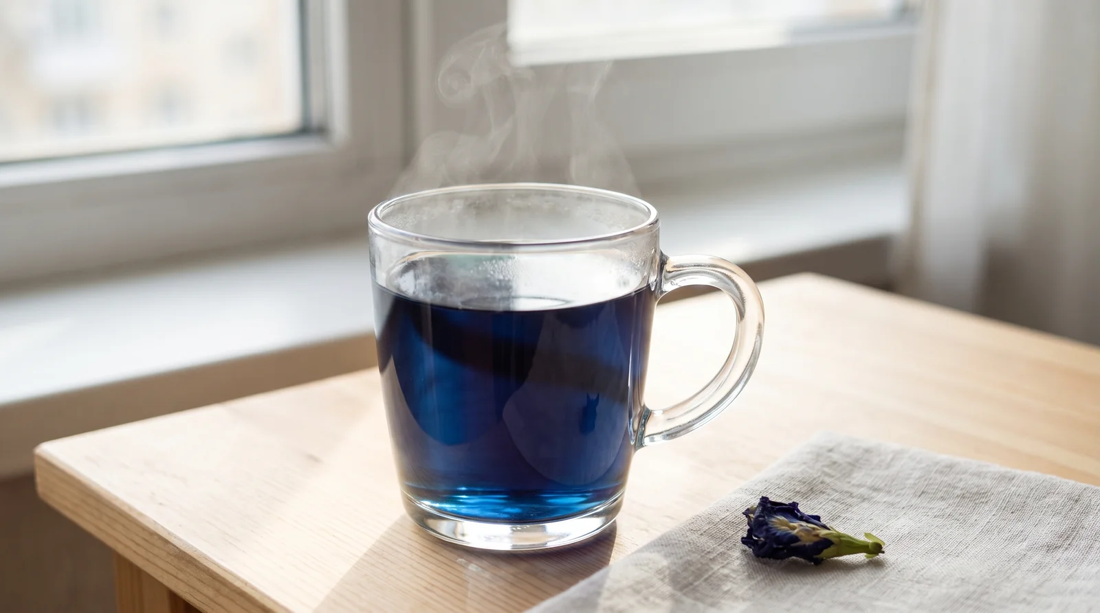 Brewed Butterfly Pea tea in a glass mug, vivid natural blue color