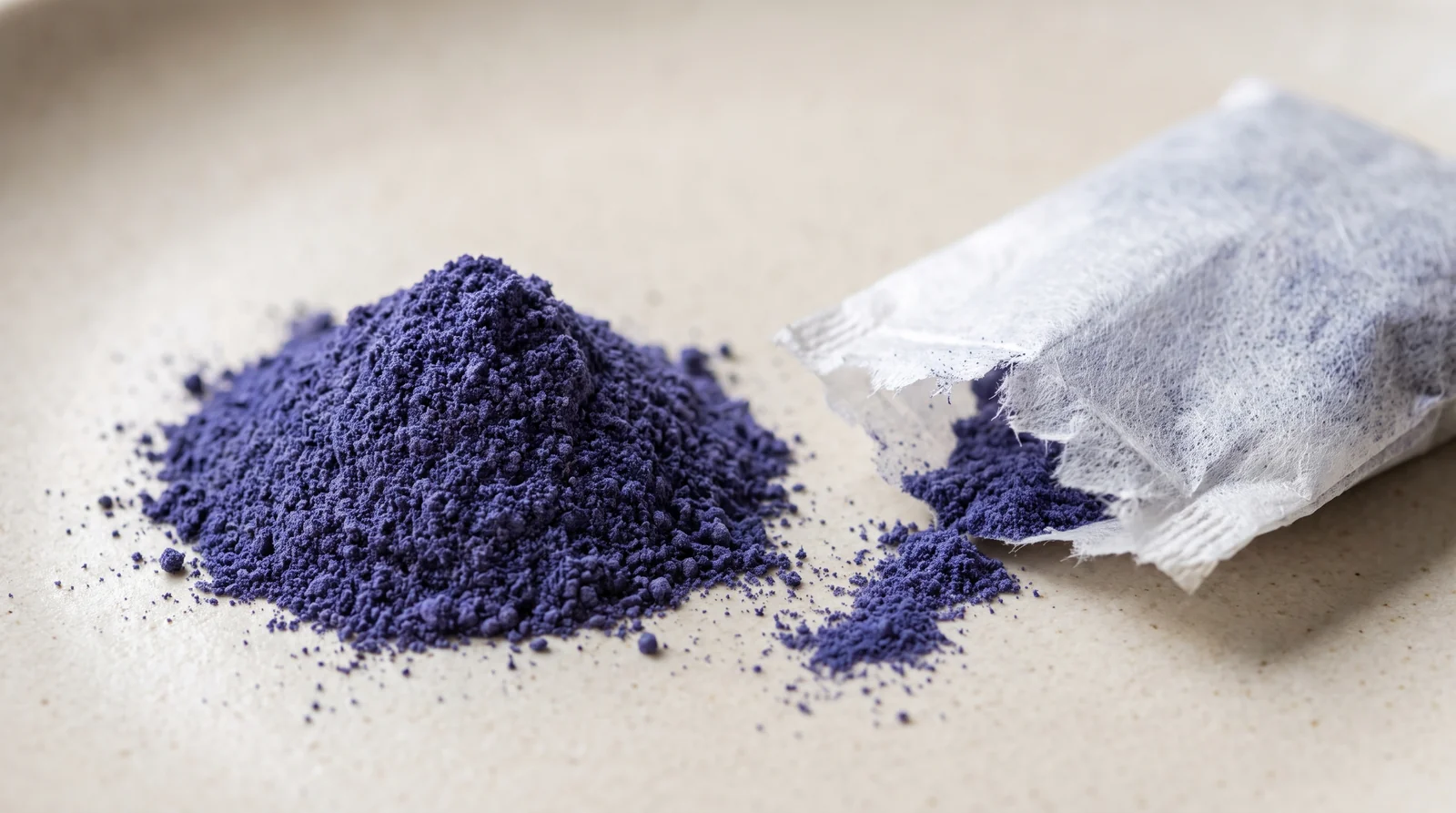 Butterfly Pea flower powder from an opened tea bag, Clitoria ternatea Sri Lanka